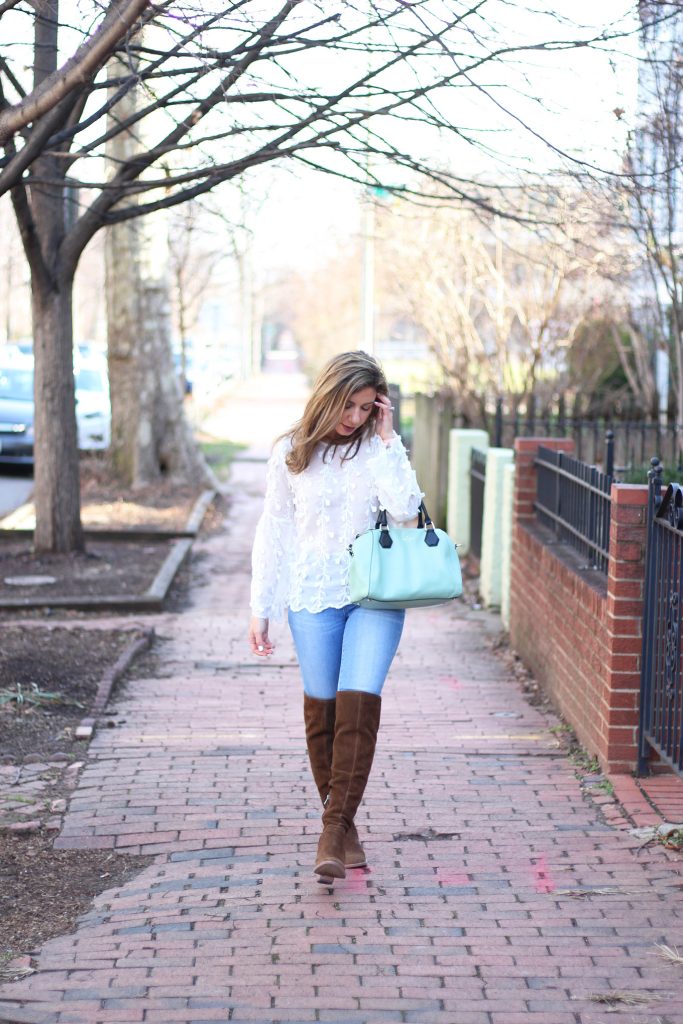 Lifestyle blogger Roxanne Birnbaum of Glass of Glam wearing Shein embroidered bouse, Madewell Denim, and Vince Camuto over the knee boots