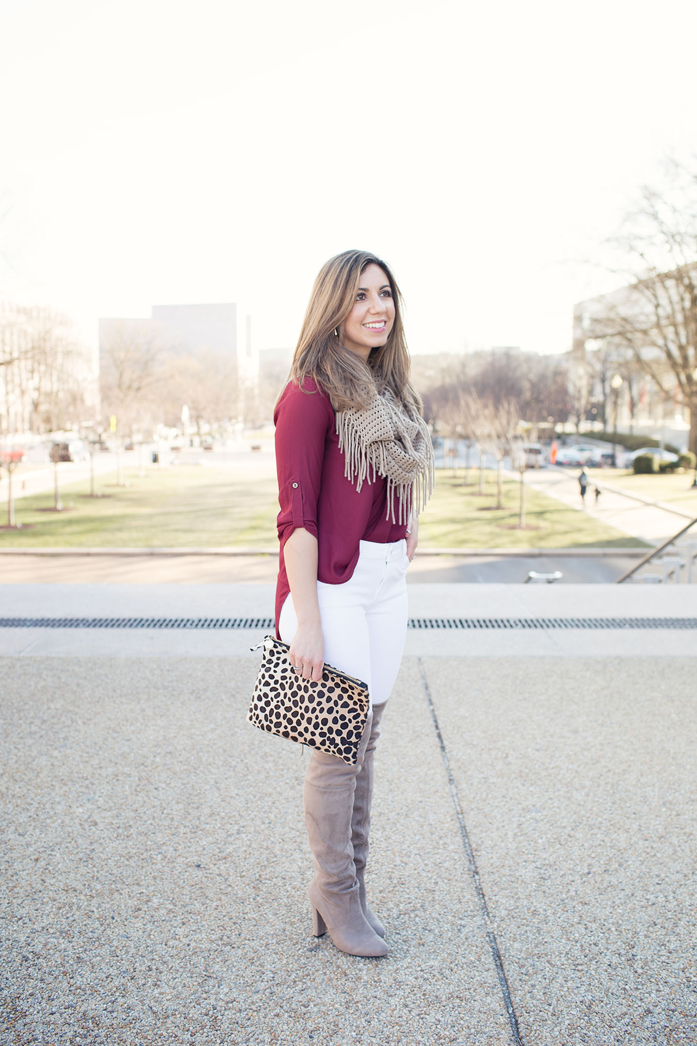 Lifestyle Blogger Roxanne Birnbaum of Glass of Glam in a Lush Clothing top, Old Navy denim, Steve Madden over the knee boots, Nordstrom scarf, and Clare Vivier leopard clutch