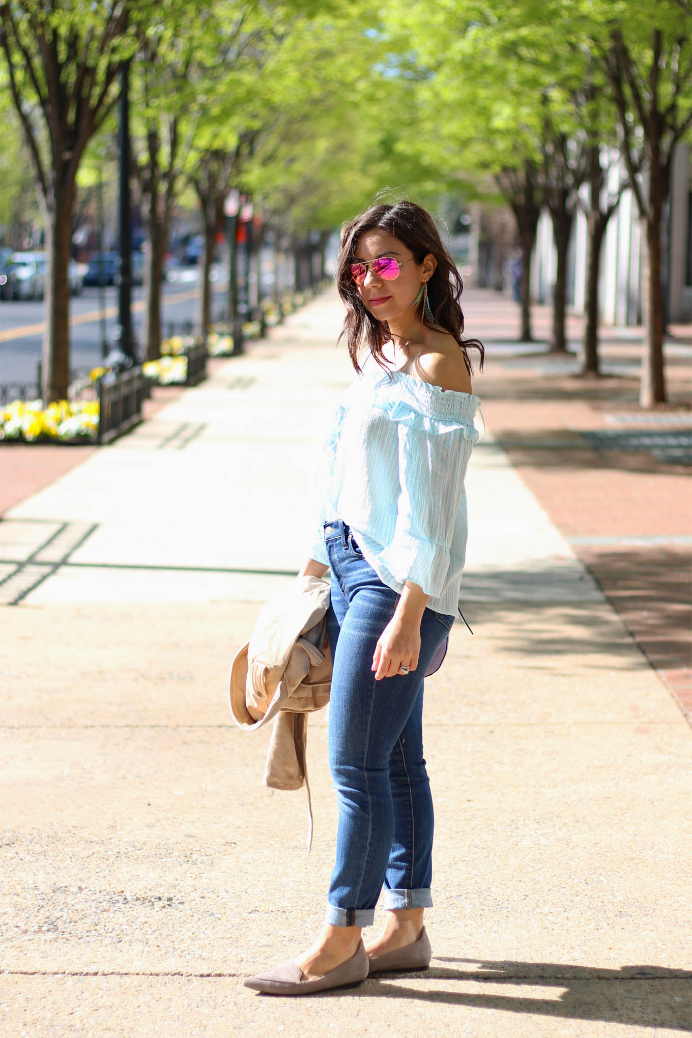 Lifestyle Blogger Roxanne of Glass of Glam wearing a sky blue sugarlips top, Tobi faux suede jacket, M.Gemi Flats, Madewell denim, and a Justfab bag