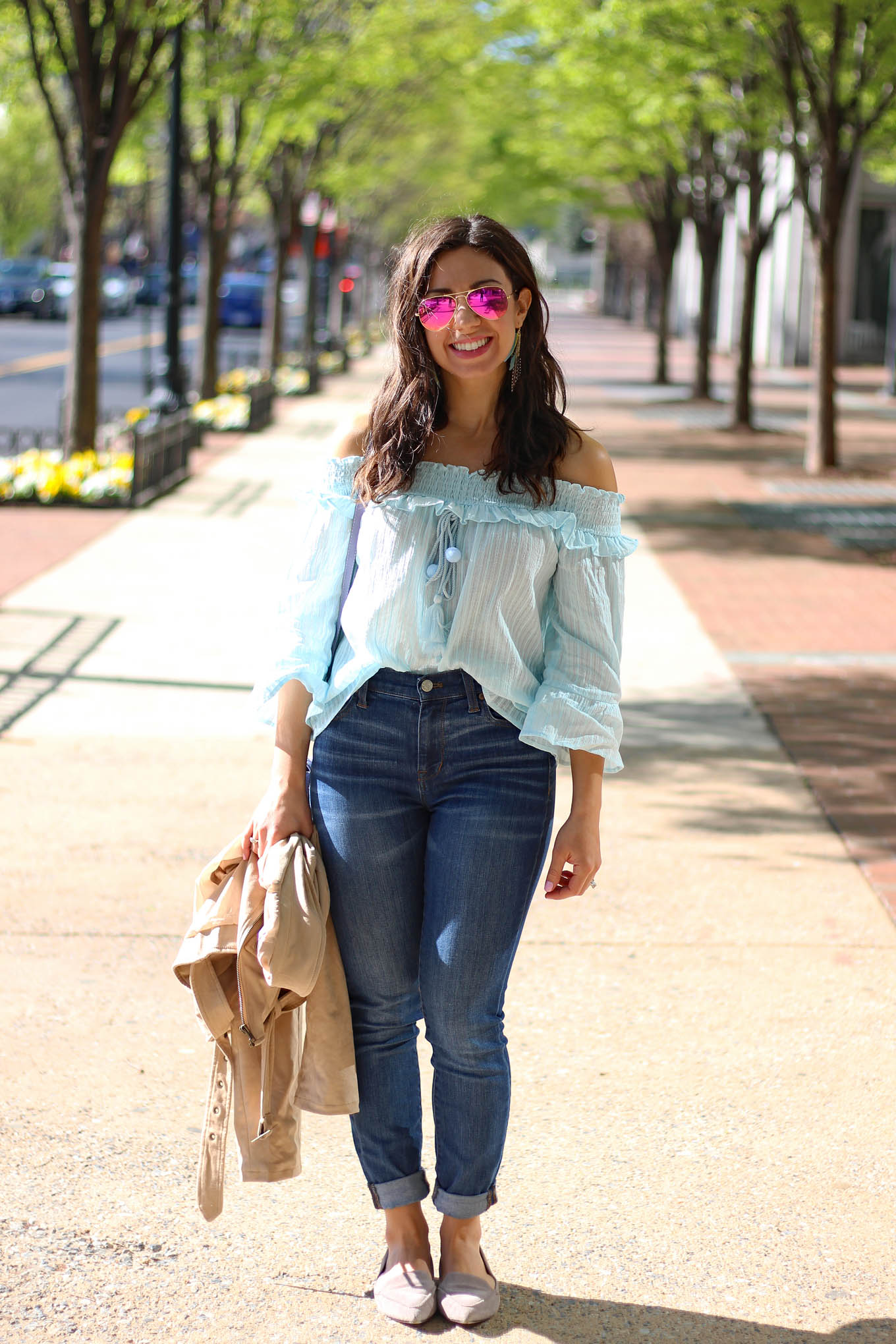 Lifestyle Blogger Roxanne of Glass of Glam wearing a sky blue sugarlips top, Tobi faux suede jacket, M.Gemi Flats, Madewell denim, and a Justfab bag