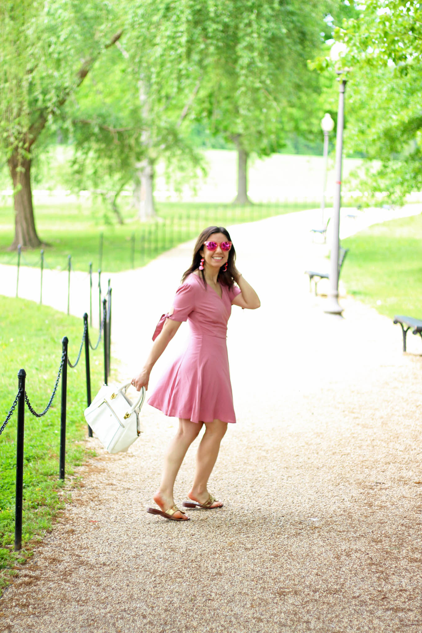 Lifestyle Blogger Roxanne of Glass of Glam in a Pink wrap dress from Wild Blue Denim and Jack Rogers Sandals