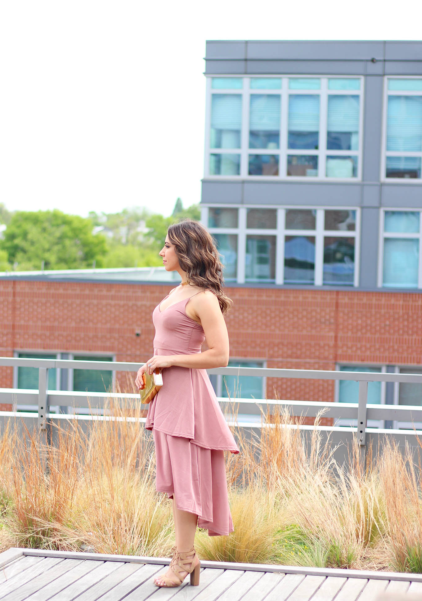 Lifestyle Blogger Roxanne of Glass of Glam wearing a blush Boohoo dress