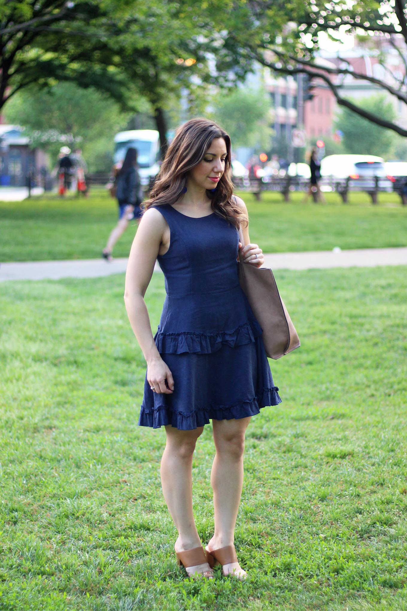 Lifestyle blogger Roxanne of Glass of Glam wearing a blue linen Francesca's dress, M.Gemi heels, Baublebar crispin drops, and a justfab bag