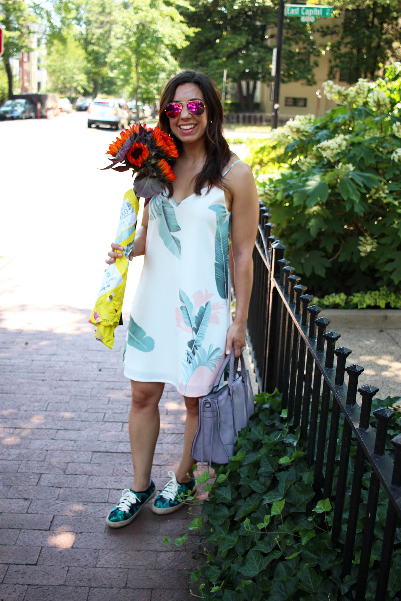 Lifestyle blogger Roxanne of Glass of Glam wearing a shein palm print dress