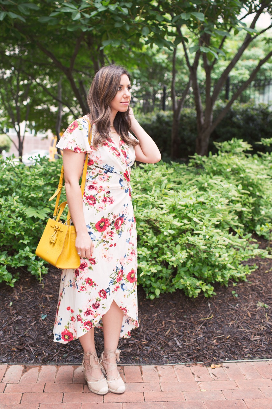 Lifestyle blogger Roxanne of Glass of Glam wearing a Xehar floral wrap print dress and lace up espadrilles and a Kate Spade bag