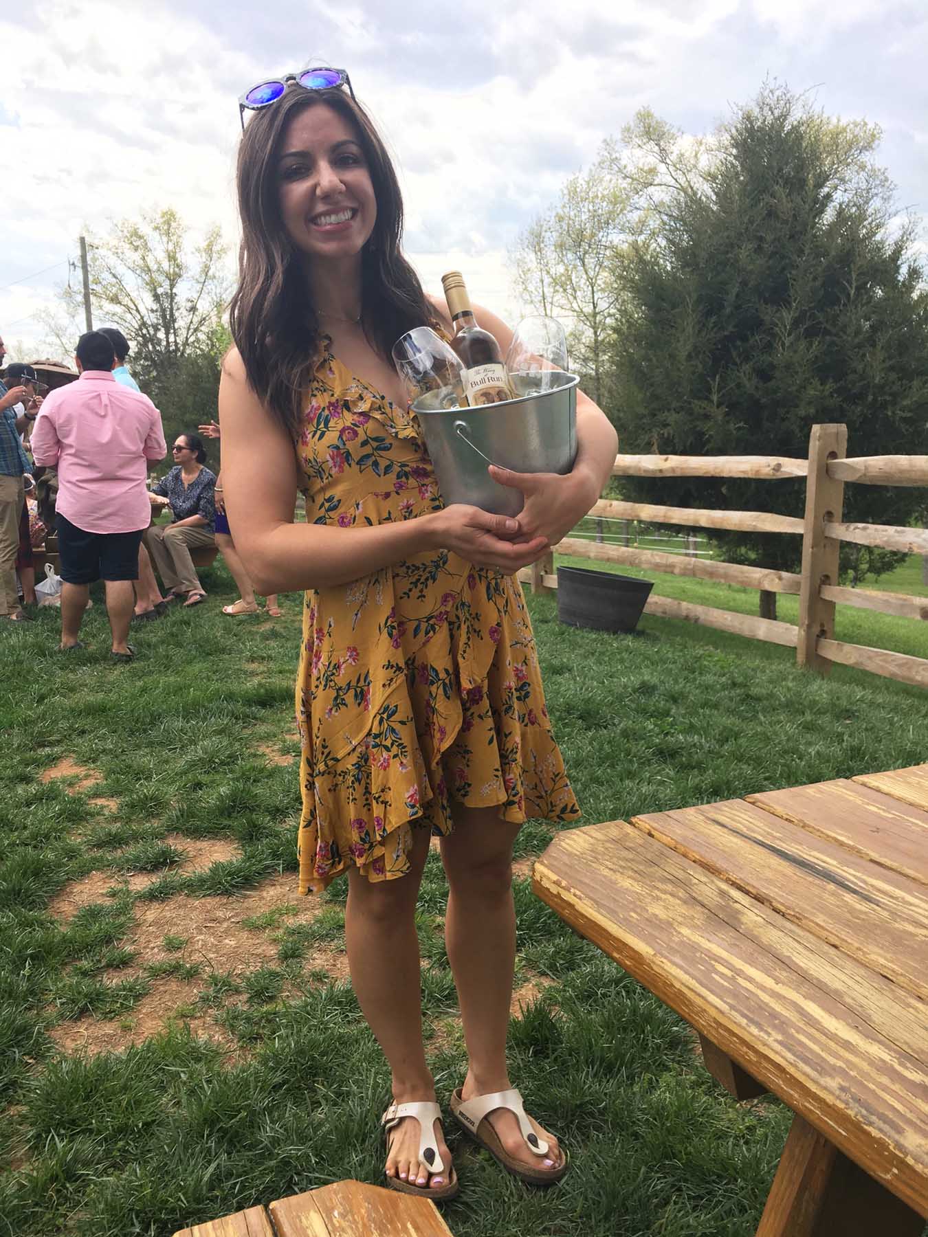 Lifestyle blogger Roxanne of Glass of Glam wearing a yellow floral zaful dress at Bull Run Winery