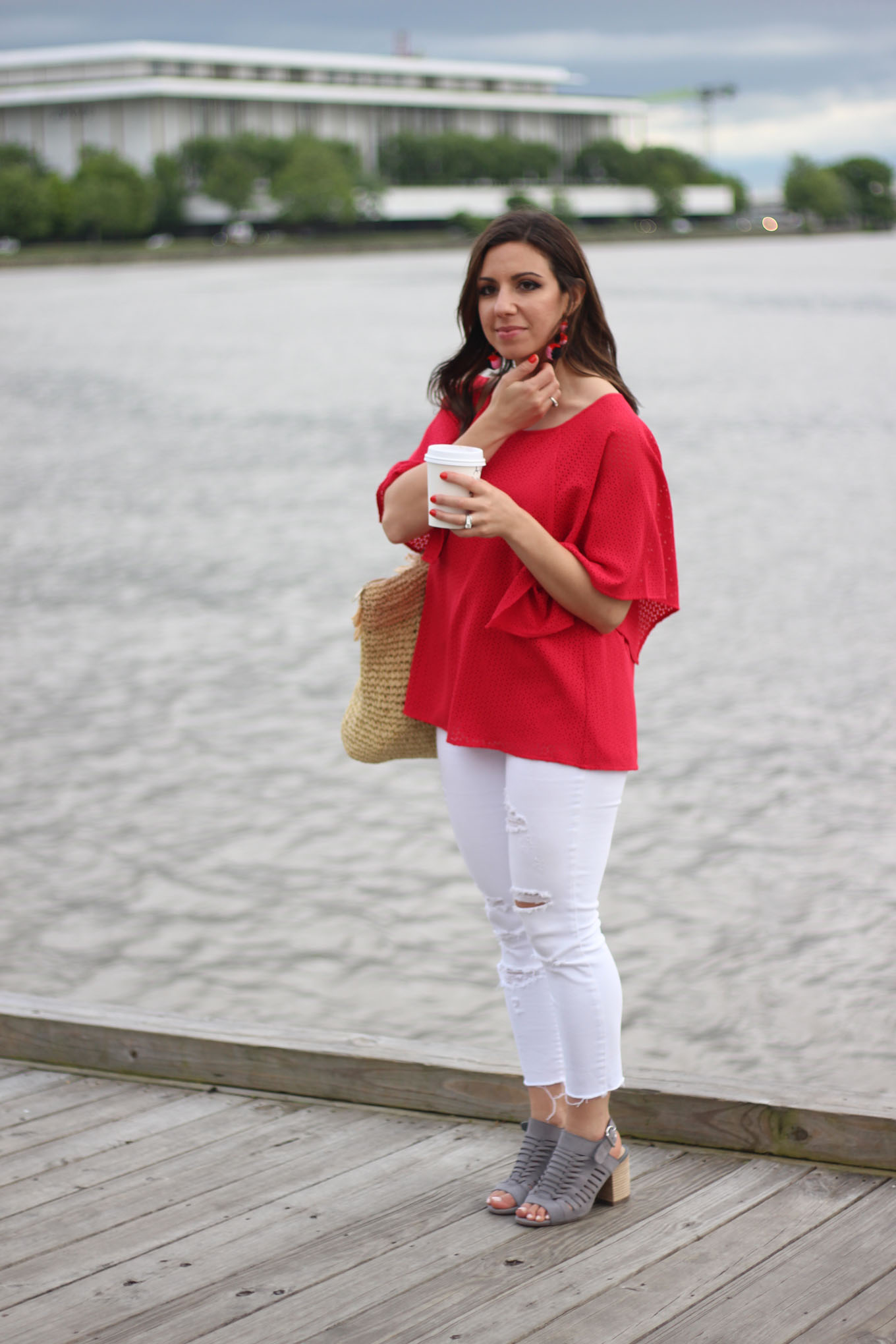 Lifestyle blogger Roxanne of Glass of Glam wearing a red Cuddy Studios top and Old Navy Denim
