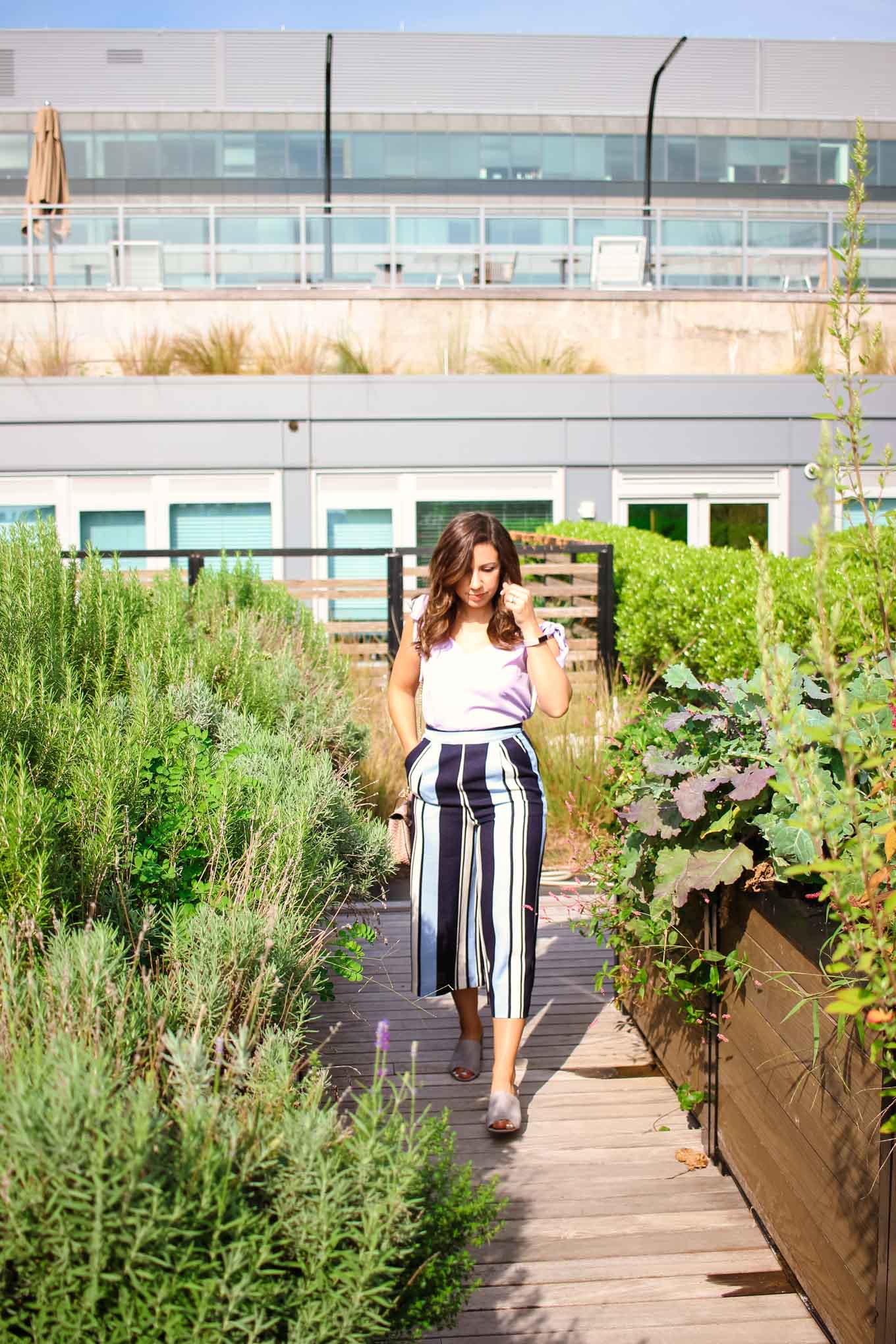 Lifestyle blogger Roxanne of Glass of Glam's striped Le Tote pants