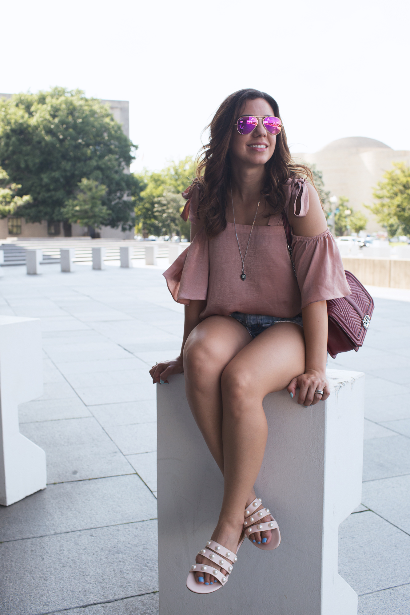 Lifestyle blogger Roxanne of Glass of Glam wearing Moonglow jewelry and Rayban sunglasses