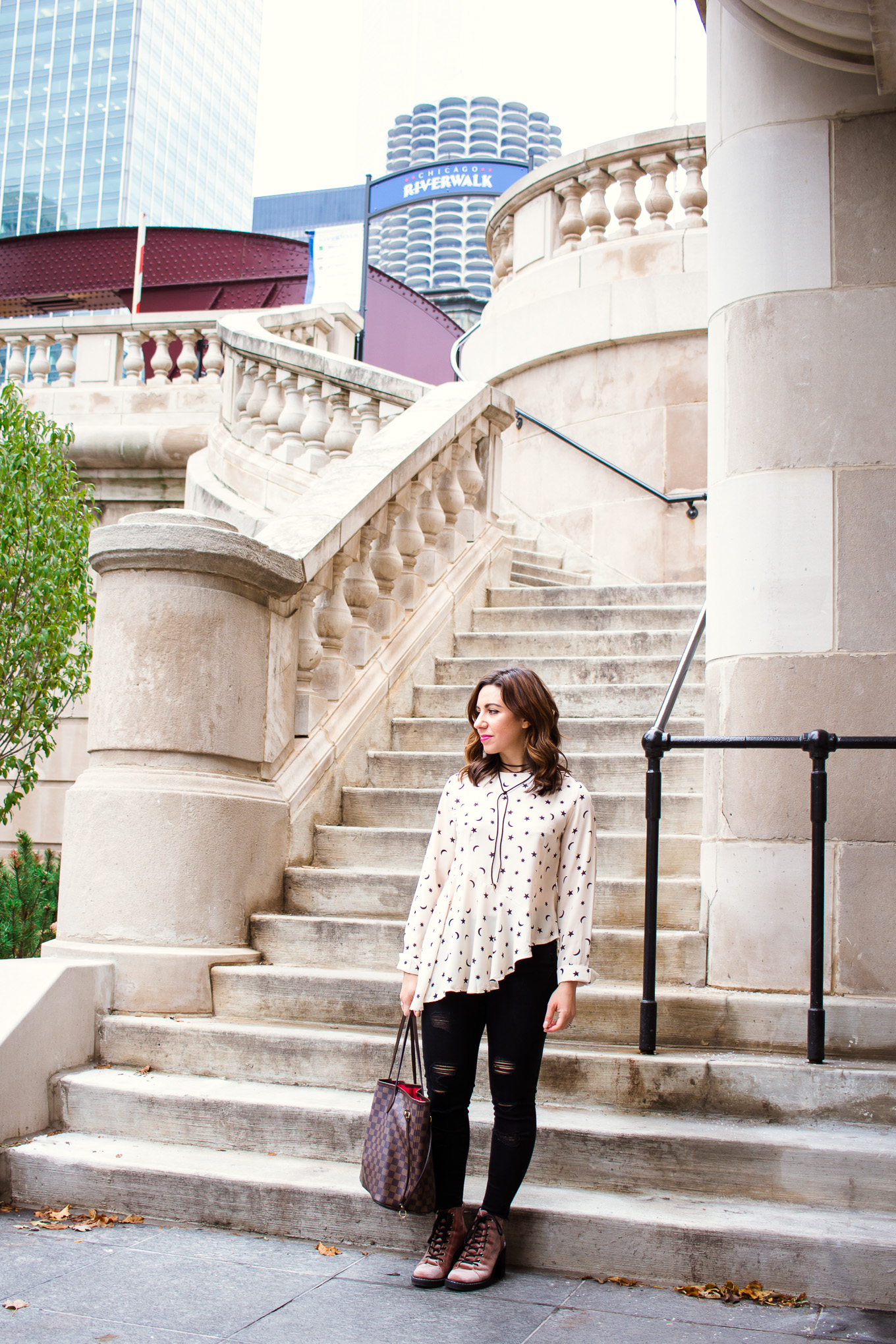 Lifestyle blogger Roxanne of Glass of Glam wearing a star print asymmetrical top, Old Navy denim, and pink combat boots - Asymmetric top with star print by popular Chicago fashion blogger Glass of Glam