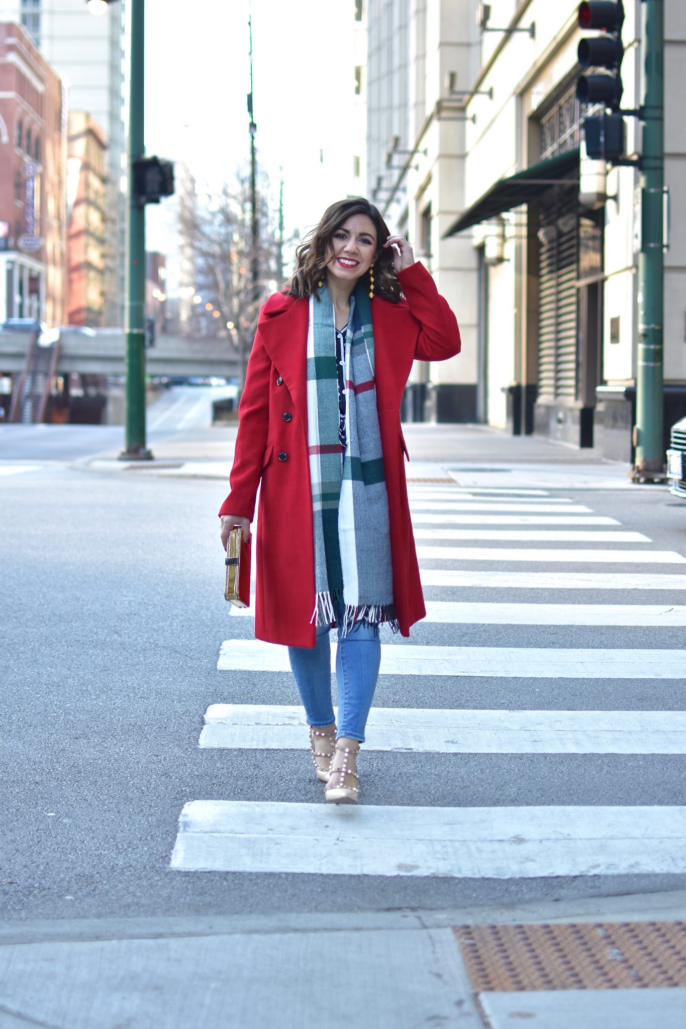 Lifestyle blogger Roxanne of Glass of Glam wearing a red ASOS coat, Valentino rockstud heels, a plaid scarf, and Madewell denim | What Being Jewish at Christmas is Like featured by top Chicago lifestyle blogger, Glass of Glam