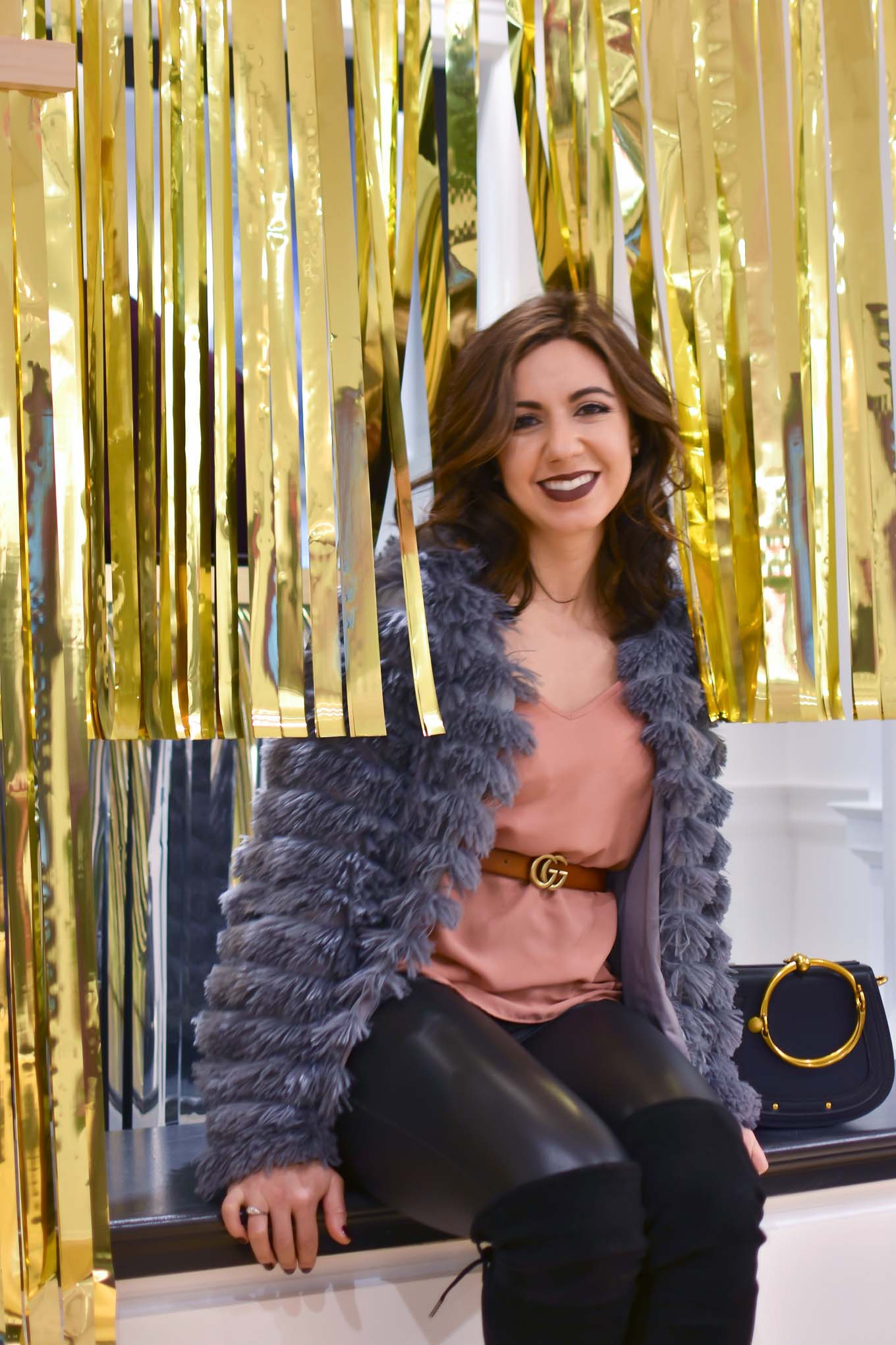 Lifestyle blogger Roxanne of Glass of Glam wearing an Amazon fashion faux fur jacket, faux leather leggings, Chloe Nile bag, otk boots, and Gerard Cosmetics lipstick - Faux Leather leggings by popular Chicago fashion blogger Glass of Glam