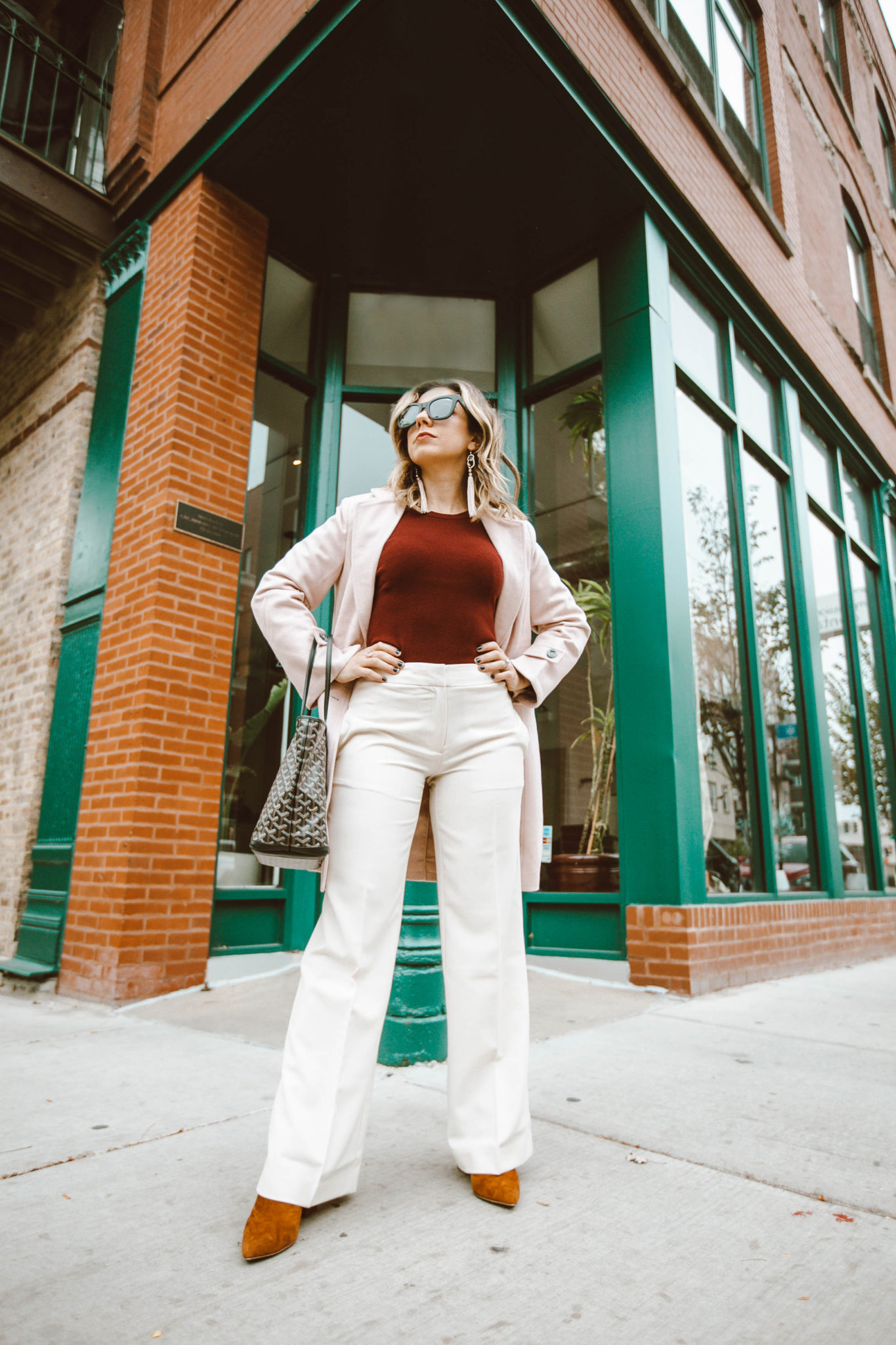 Trendy workwear featured by top Chicago fashion blog, Glass of Glam: picture of a woman wearing Chadwicks pants, Chadwicks coat and Chadwicks sweater, Steve Madden booties, Goyard bag and Quay sunglasses