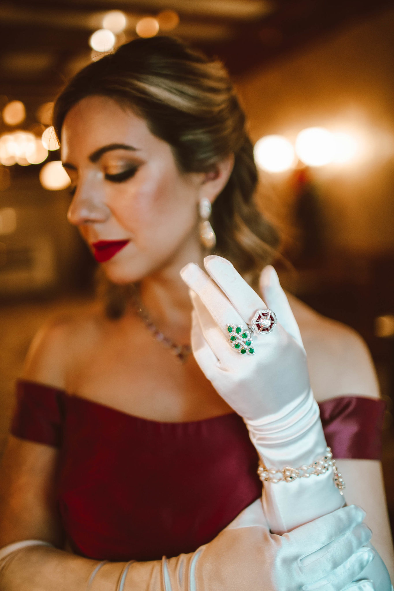 Glamorous holiday look featured by top Chicago fashion blog, Glass of Glam: image of a woman wearing a Monique Lhuillier gown, a Gigi New York clutch, glitter stiletto pumps, Amazon satin gloves