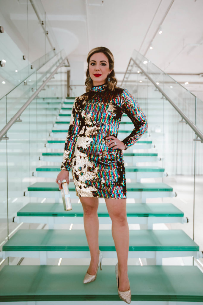 Gold sequin dress for NYE featured by top Chicago fashion blog, Glass of Glam: image of a woman wearing a Dress the Population gold sequin dress, glitter stiletto pumps and Ivy and Rose vintage jewelry.