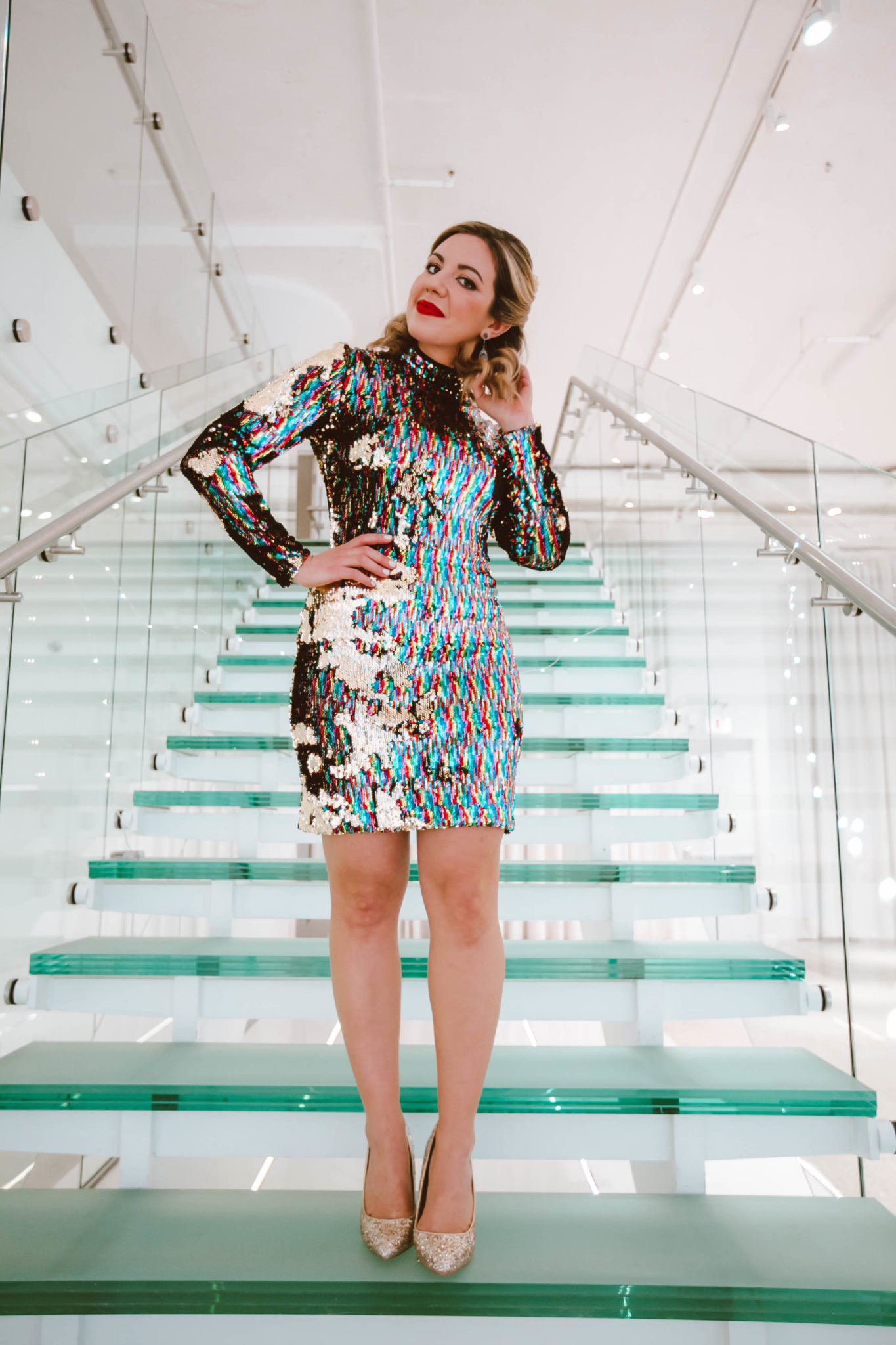 Gold sequin dress for NYE featured by top Chicago fashion blog, Glass of Glam: image of a woman wearing a Dress the Population gold sequin dress, glitter stiletto pumps and Ivy and Rose vintage jewelry.