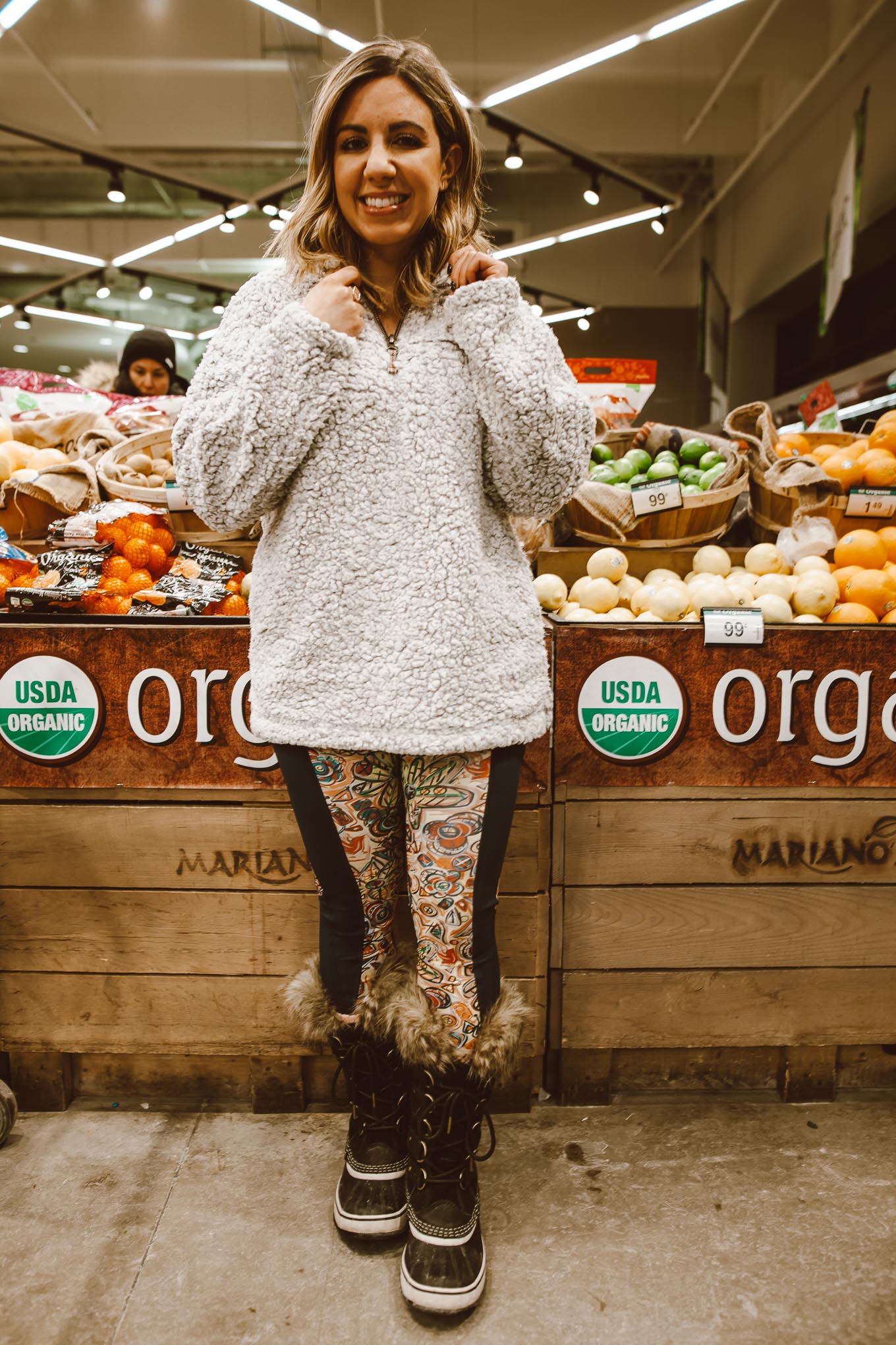Winter activewear featured by top US fashion blog, Glass of Glam: image of a woman at a grocery store wearing Thread & Supply fleece pullover, Joriki leggings, Sorel boots