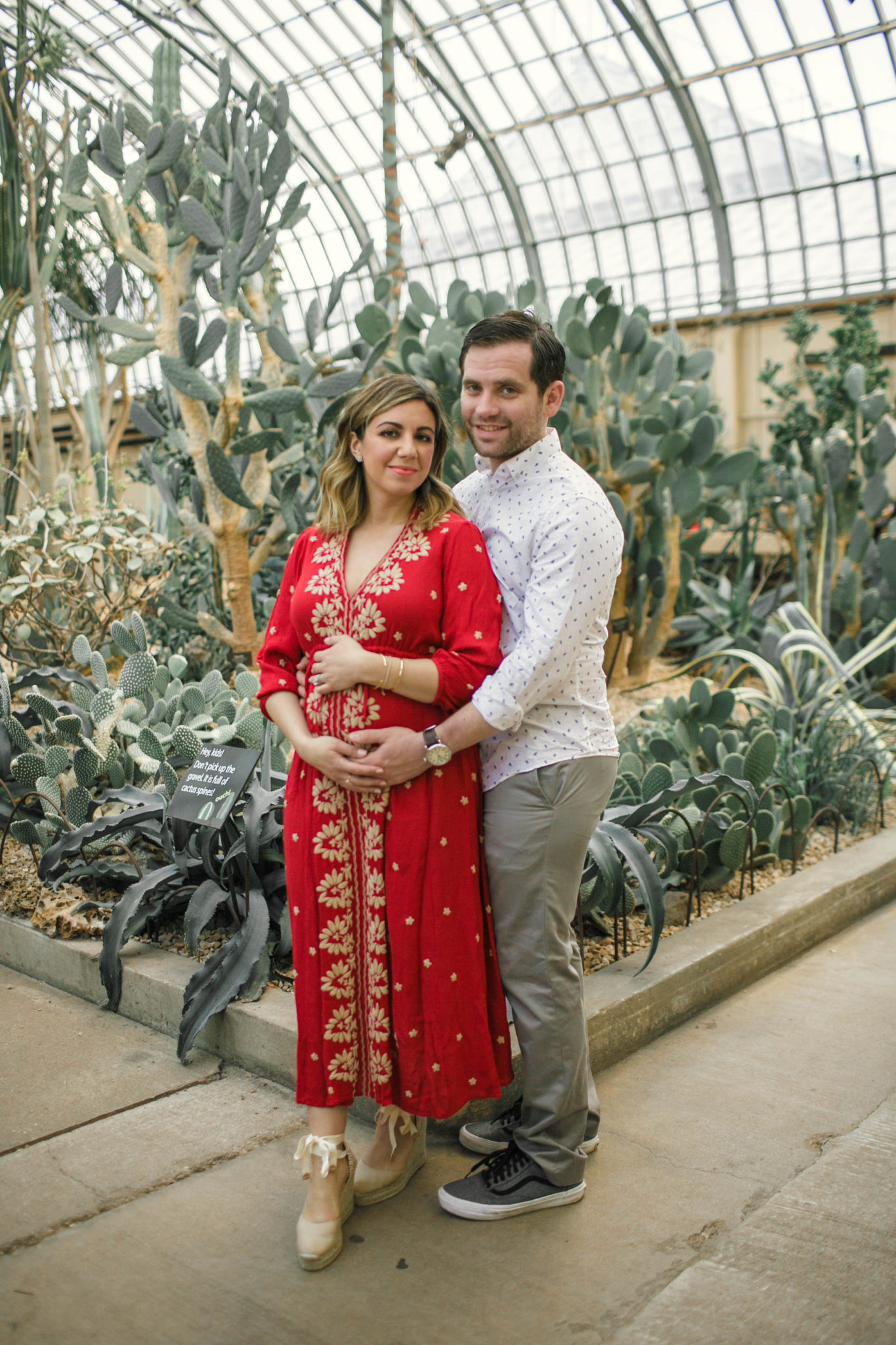 Top US life and style blog, Glass of Glam, features the gender reveal for their first baby: image of a woman wearing a Free People red embroidered midi dress and Castaner wedge espadrilles