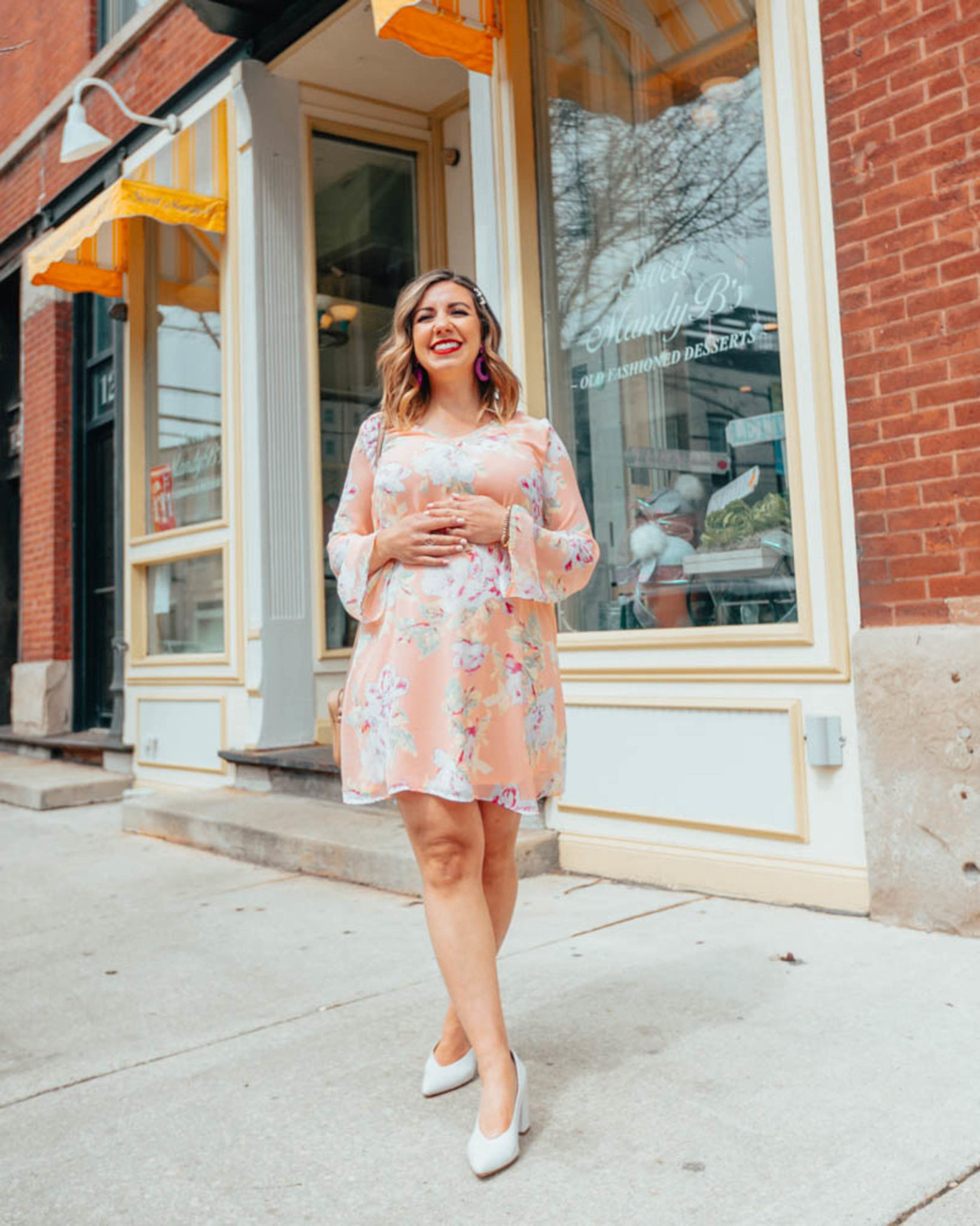 The Best shops to shop for cute maternity clothing featured by top US fashion blog, Glass of Glam: image of a pregnant woman wearing a Pink Blush maternity dress, Naturalizer toe pumps, BaubleBar drop earrings, GUCCI leather bag, and Target pearl bobby pins