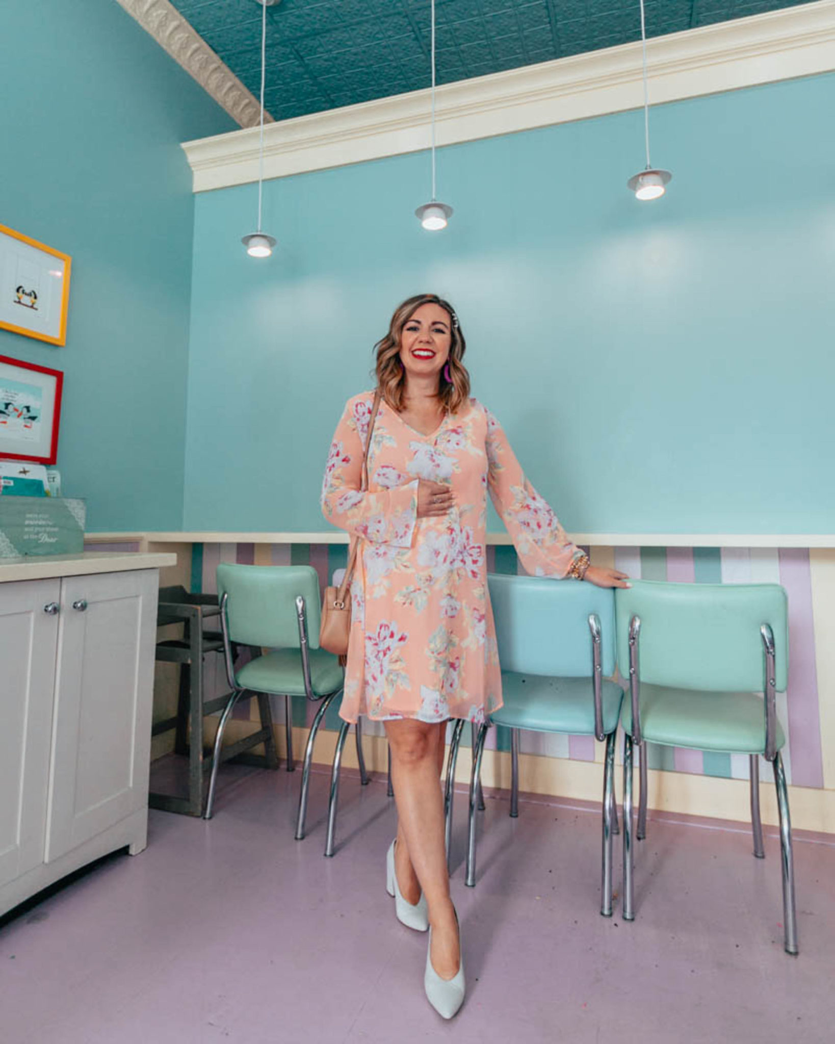 The Best shops to shop for cute maternity clothing featured by top US fashion blog, Glass of Glam: image of a pregnant woman wearing a Pink Blush maternity dress, Naturalizer toe pumps, BaubleBar drop earrings, GUCCI leather bag, and Target pearl bobby pins