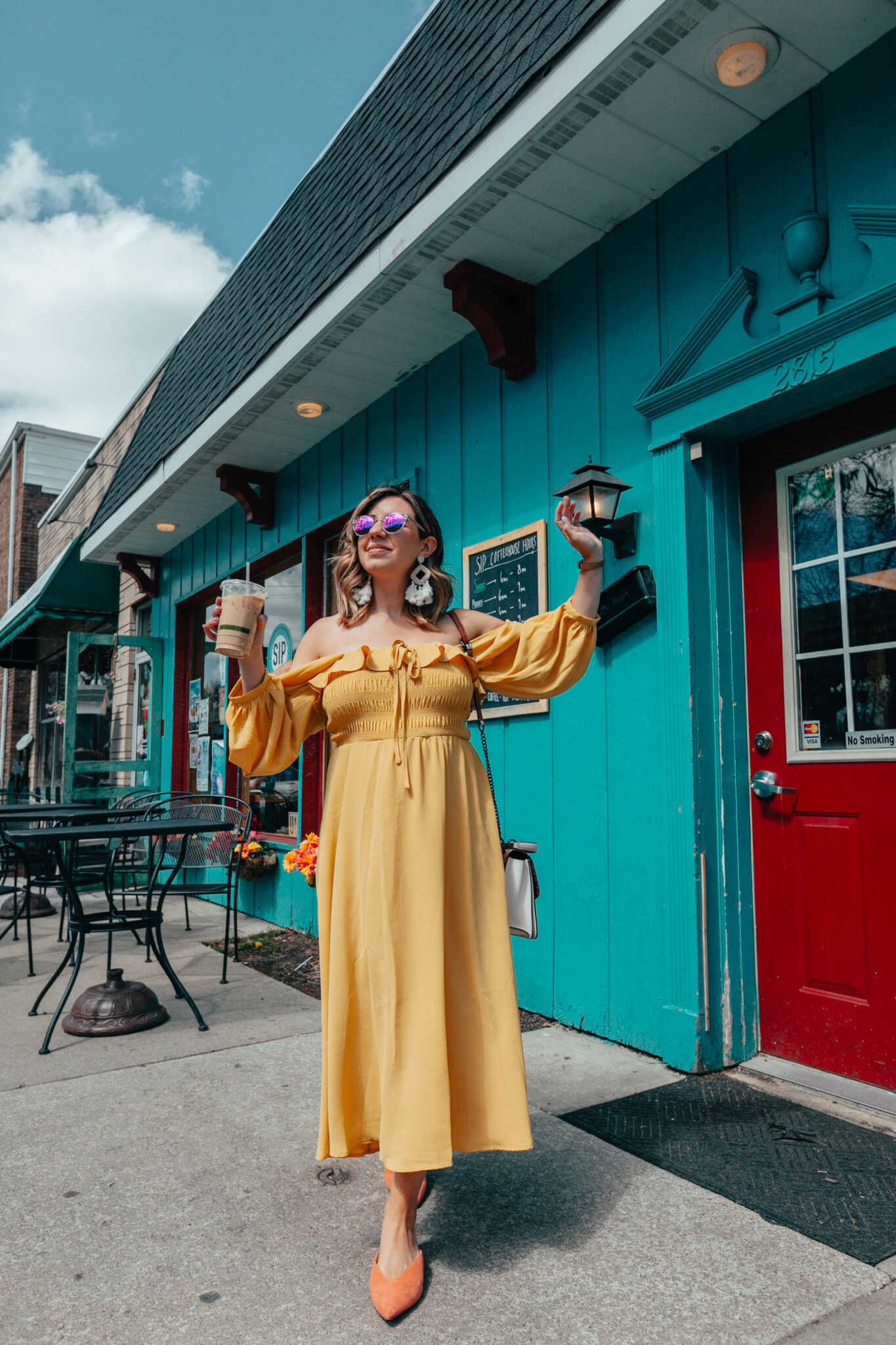 Spring colors look featured by top US fashion blog, Glass of Glam: image of a woman wearing a SheIn off the shoulder yellow dress, Sole Society orange mules, Warby Parker sunglasses, bohemian statement earrings, and a COACH shoulder bag 