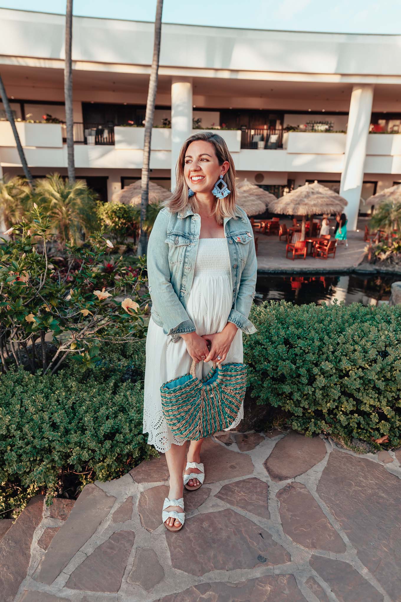 Shopbop sale maternity favorites featured by top US fashion blog, Glass of Glam: image of a woman wearing an Ingrid & Isabel dress, Splendid flat sandals, Old Navy denim jacket, and BAUBLEBAR statement earrings