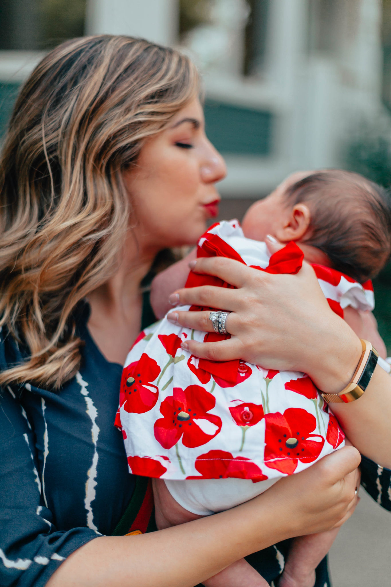 Designing My Push Present: Ivy and Rose Jewelry by popular Chicago fashion blog, Glass of Glam: image of a woman holding her baby and wearing a custom ring from Ivy and Rose Jewelry and a All in Favor Print Wrap Front Gathered Hem Top.