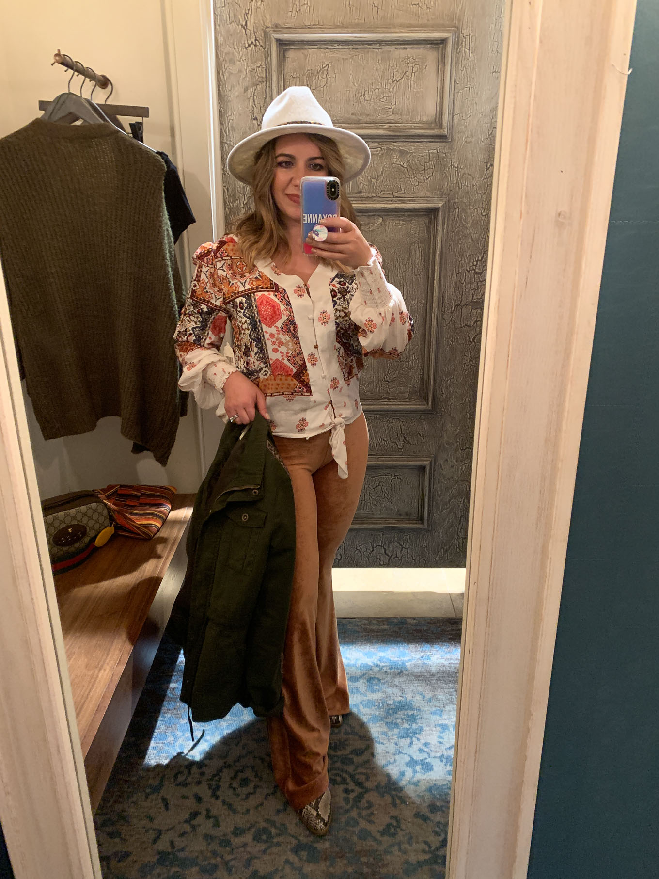 Fall Fashion at Woodfield Mall by popular Chicago fashion blog, Glass of Glam: image of a woman standing in a dressing room at Altar'd State and trying on clothes.