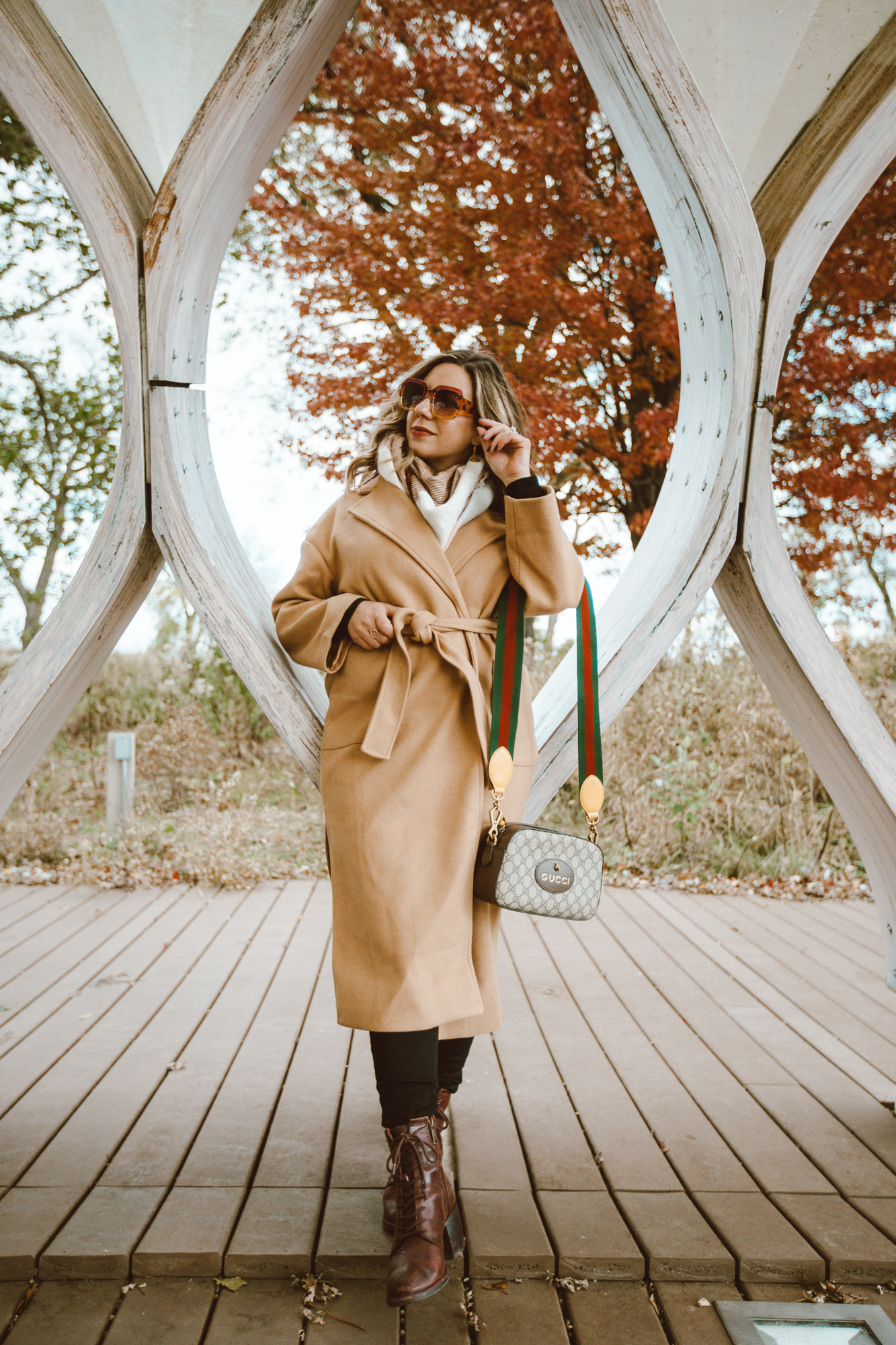 Cyber Monday Shein Sale by popular Chicago fashion blog, Glass of Glam: image of a woman outside wearing a Shein Notched Collar Split Hem Belted Coat, Macy's Patricia Nash Sicily Booties, Ann Taylor Petite Sculpting Pockets High Rise Skinny Jeans In Jet Black Wash, scarf and holding a Gucci GG Supreme messenger bag.