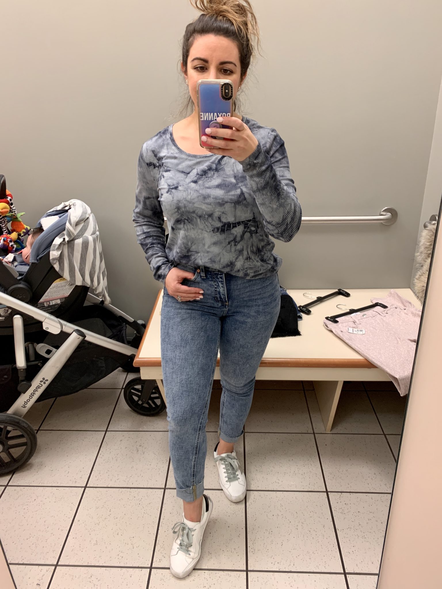 Kohl's Spring Try On by popular Chicago fashion blog, Glass of Glam: collage image of a woman standing in a Kohl's dressing room and wearing a tie dye long sleeve top, Kohl's Women's LC Lauren Conrad High-Waisted Skinny Ankle Jeans, and SheIn Star Patch Lace Up Splice Sneakers.