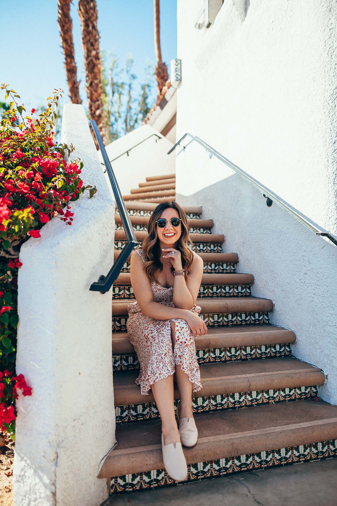 Boc Flats by popular Chicago fashion blog, Glass of Glam: image of a woman on a Spanish tile staircase and wearing a floral sleeveless dress and SUREE SLIP-ON.