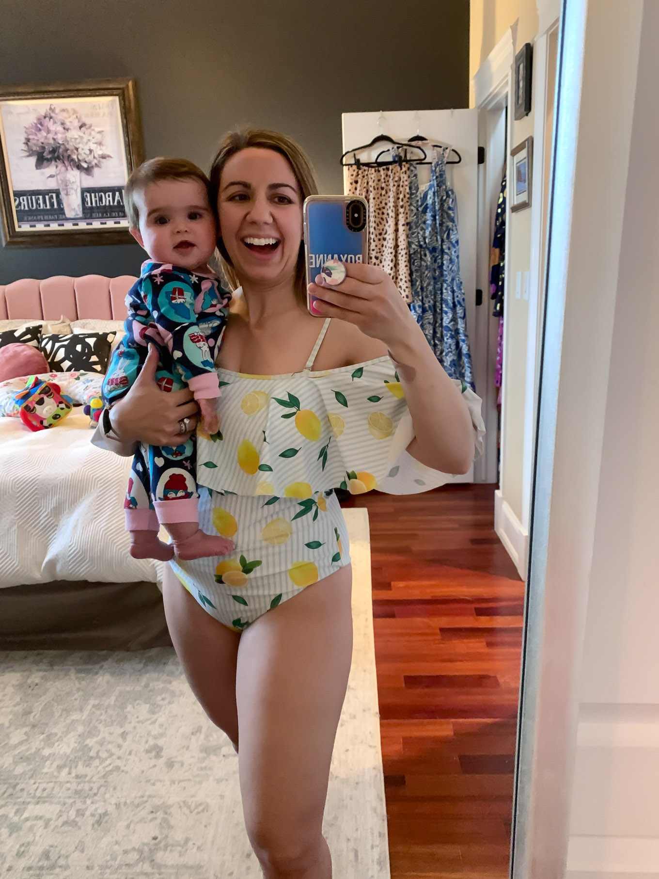 At Home Swimwear Try On by popular Chicago fashion blog, Glass of Glam: image of a woman standing in her master bedroom and wearing a SheIn SHEIN Random Flounce Foldover Off Shoulder One Piece Swimsuit.