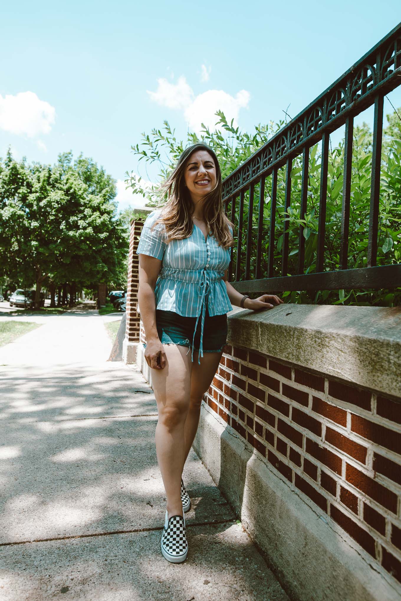  Curvy Shorts by popular Chicago fashion blog, Glass of Glam: image of Roxanne Birmbaum wearing a SHEIN Buttoned Tie Front Striped Peplum Blouse, American Eagle AE Ne(x)t Level Curvy Denim High-Waisted Short Short, and Nordstrom Classic Slip-On Sneaker VANS.