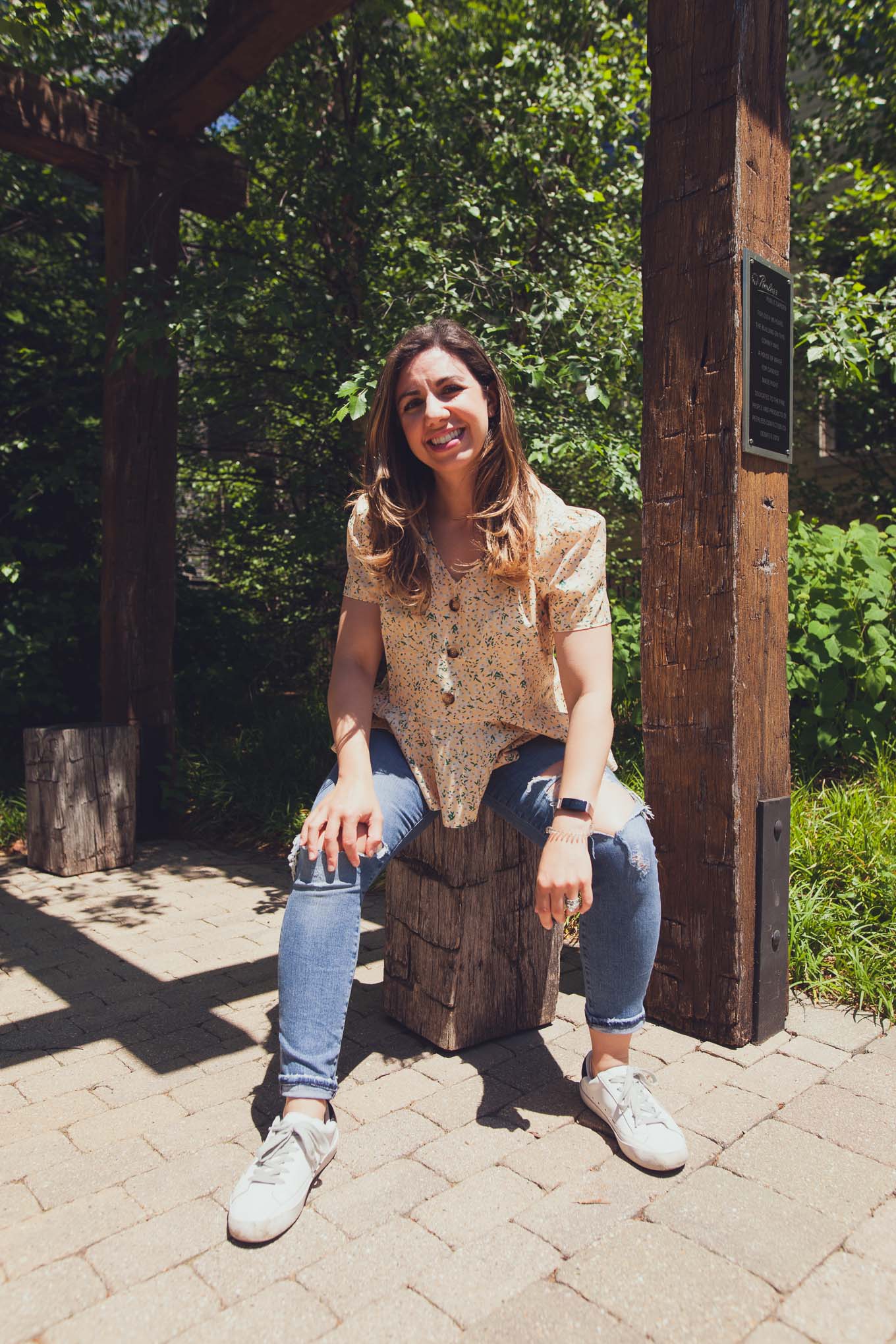 Stay Sane by popular Chicago lifestyle blog, Glass of Glam: image of a woman wearing a SheIn Ditsy Floral Print Button Front Peplum Top, AGOLDE Toni Mid Rise Straight Jeans, SheIn Star Patch Lace Up Splice Sneakers, and Amazon Intoval Bands.