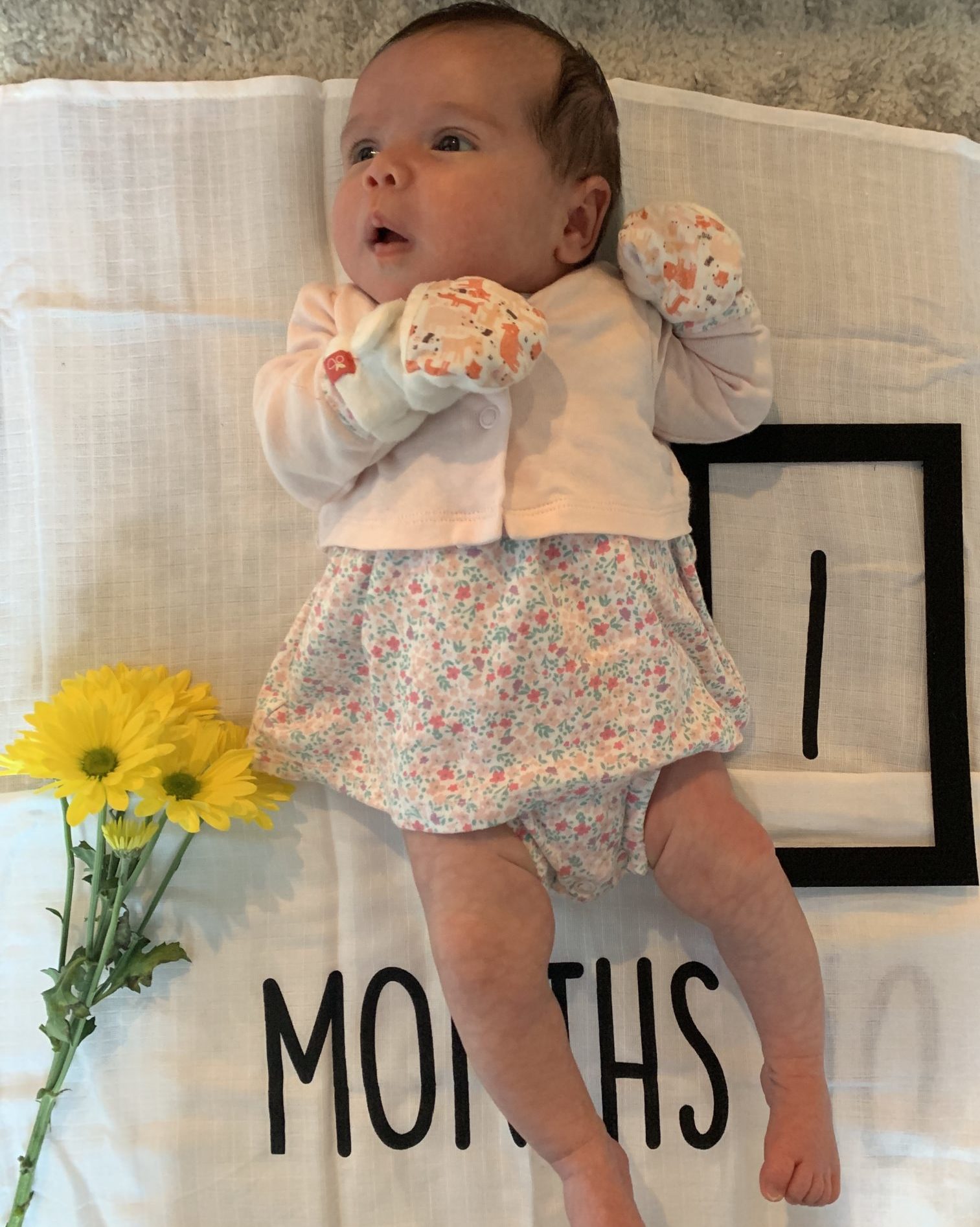 First Birthday by popular Chicago motherhood blog, Glass of Glam: image of a 1 month old baby.