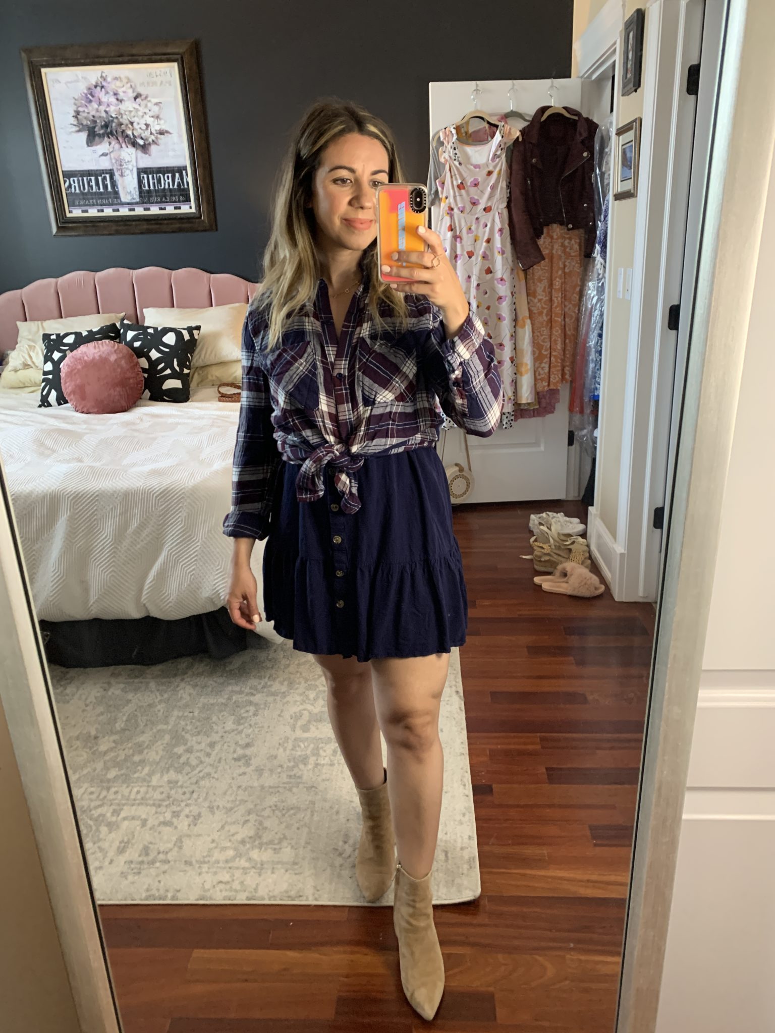 Sleeveless Dress by popular Chicago fashion blog, Glass of Glam: image of a woman standing in her bedroom and wearing a Amazon Imysty Womens Polka Dot V Neck Button Down Ruffles Loose Mini Short T-Shirt Dress, plaid button up shirt, and tan suede booties. 