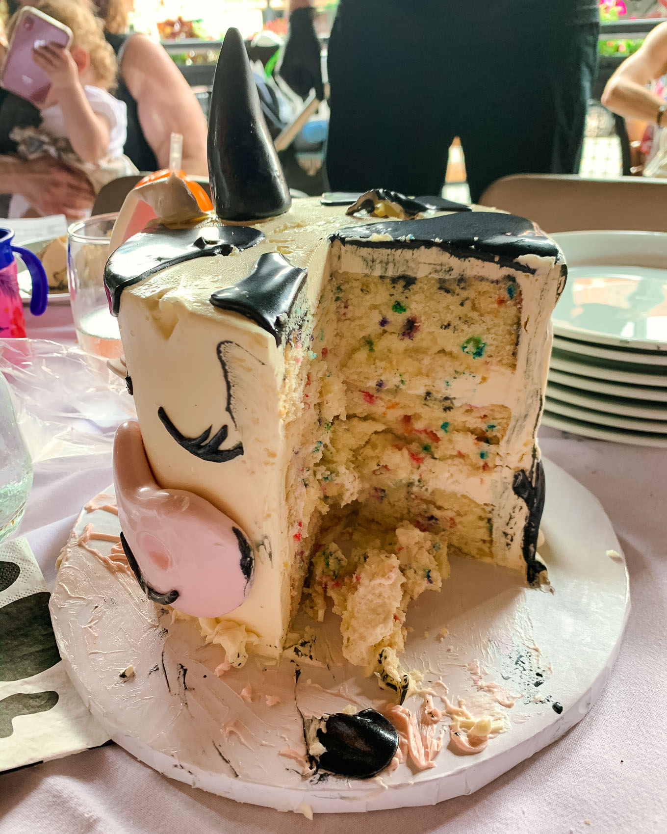 1st Birthday by popular Chicago lifestyle blog, Glass of Glam: image of a ECBG cake studio cow cake.