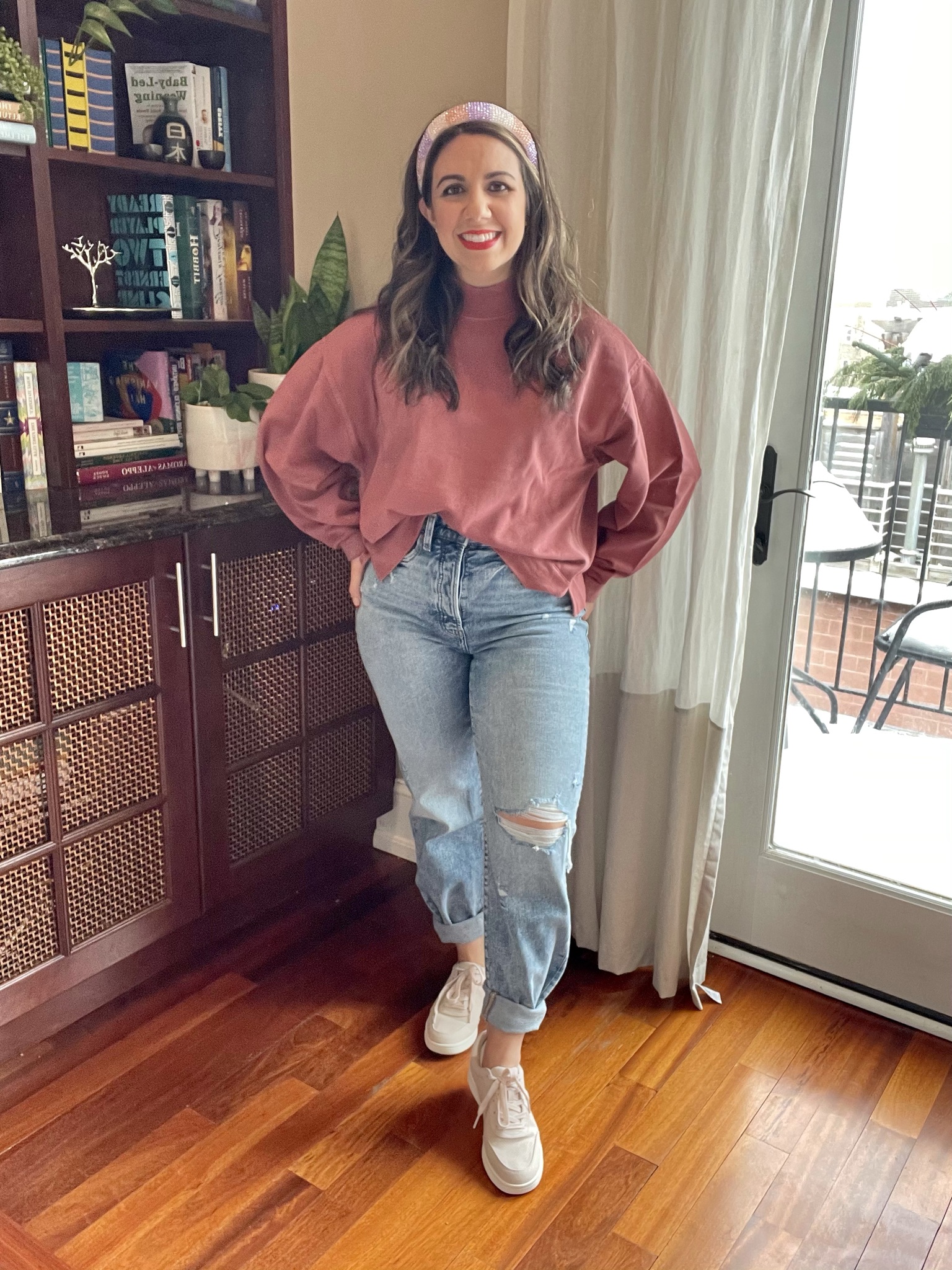 Spring Outfits from Old Navy by popular Chicago fashion blog, Glass of Glam: image of a woman wearing Old Navy high rise distressed jeans, sneakers, and a pink sweatshirt. 
