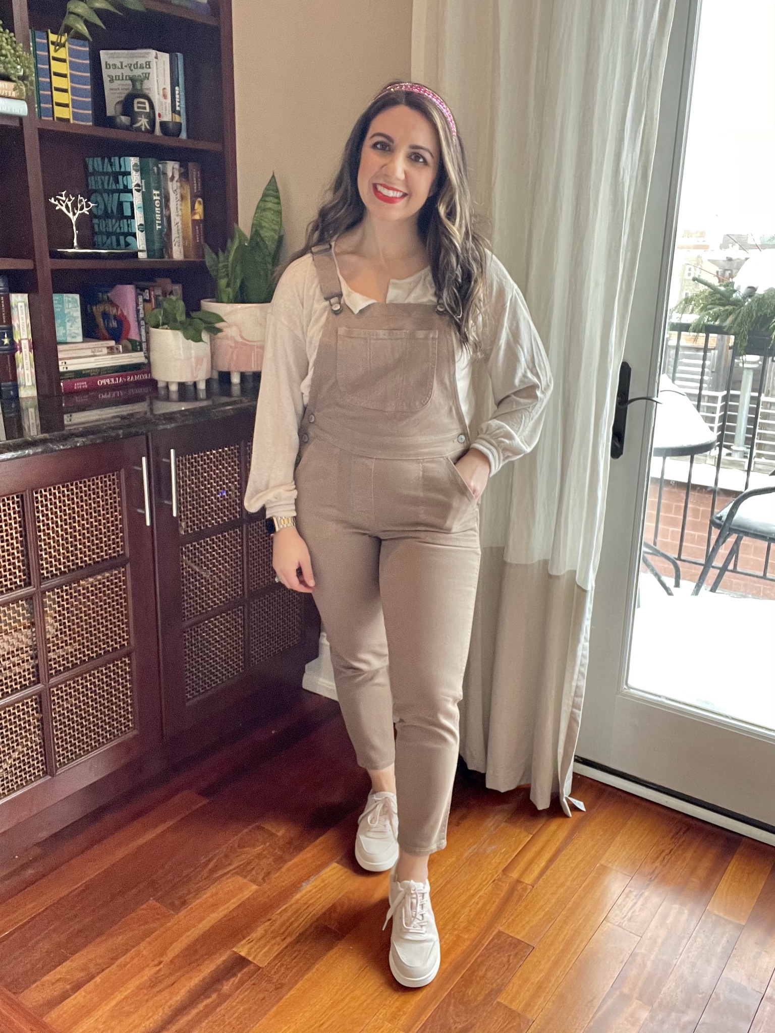 Spring Outfits from Old Navy by popular Chicago fashion blog, Glass of Glam: image of a woman wearing Old Navy overalls, cream blouse, and sneakers. 